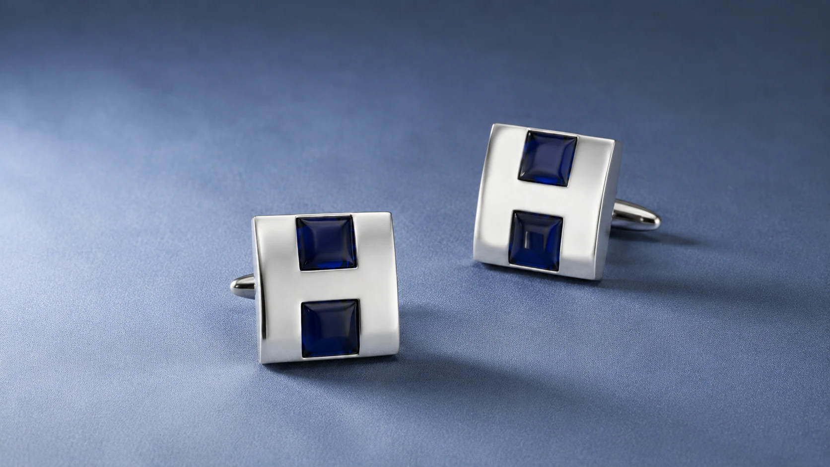 Hill cufflinks on blue velvet