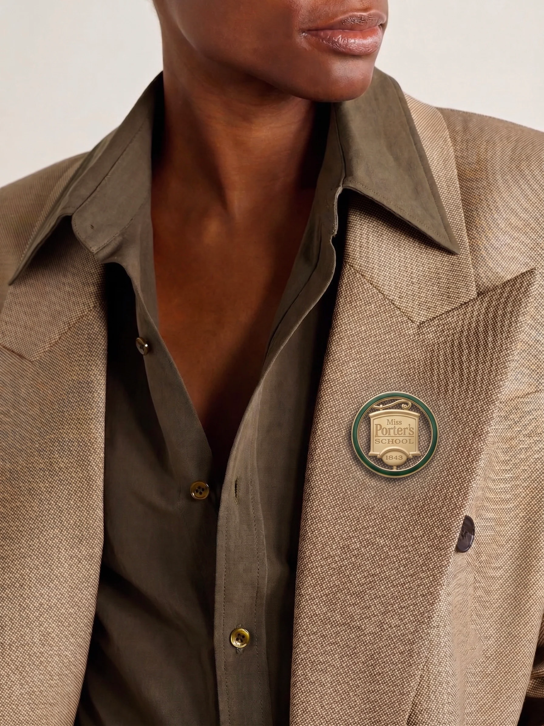 Miss Porter’s School Lapel Pin worn on a tailored jacket