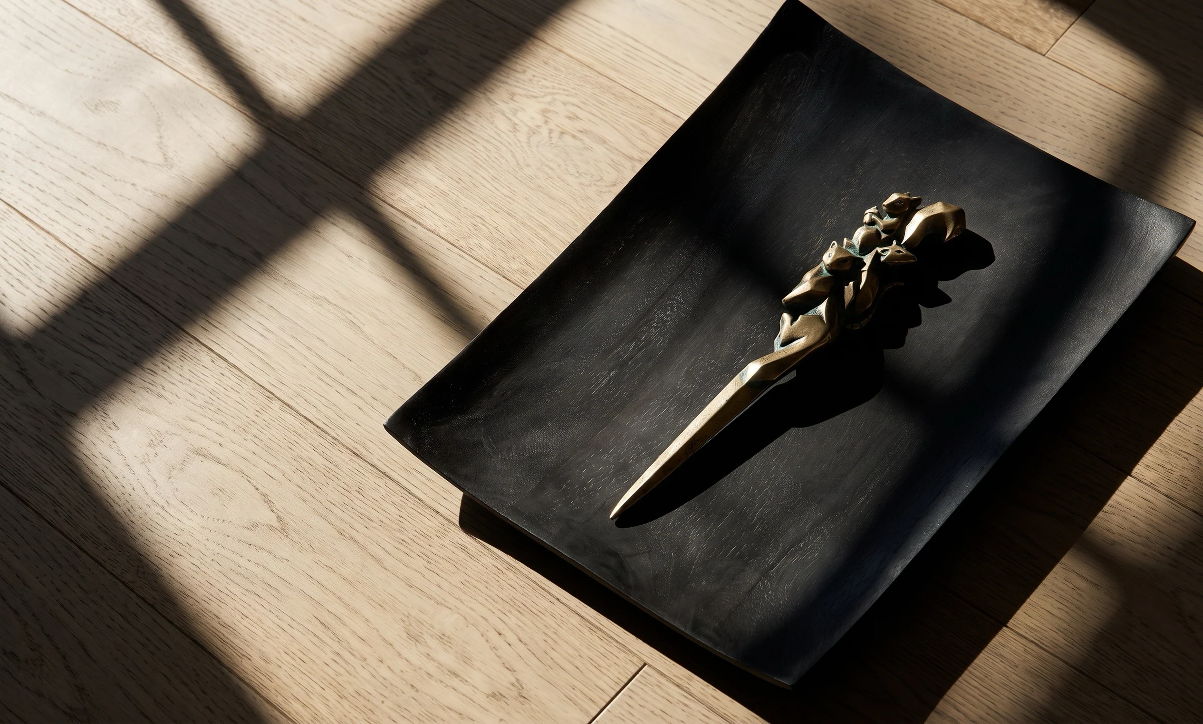 Spirit Animal Letter Opener on a dark tray