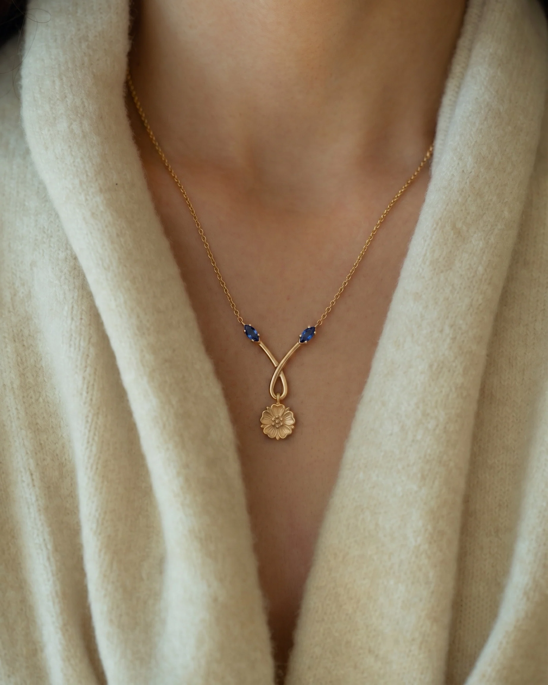 Blue sapphire necklace worn on a model